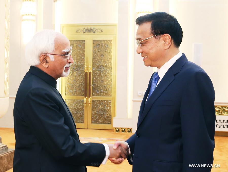 رئيس مجلس الدولة الصيني يجتمع مع نائب الرئيس الهندي 