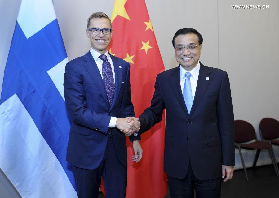 رئيس مجلس الدولة الصيني يجتمع برئيس لاتفيا ورئيس الوزراء الفنلندي