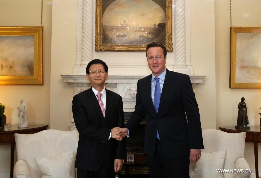 اجتماع منغ جيان تشو مع رئيس الوزراء البريطاني ديفيد كاميرون