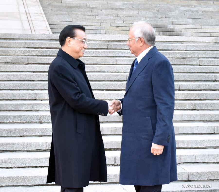 الصين وماليزيا توقعان اتفاقيات تعاون