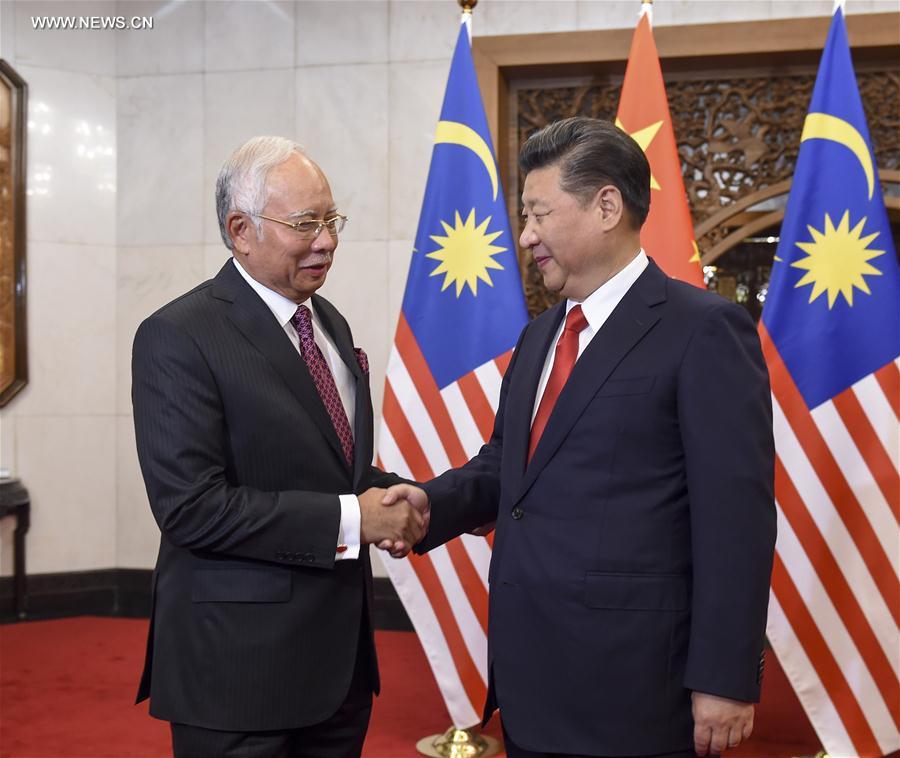 شي يتعهد بتعزيز الشراكة الاستراتيجية الشاملة مع ماليزيا