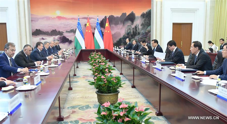 الصين وأوزبكستان تتعهدان بتعزيز التعاون