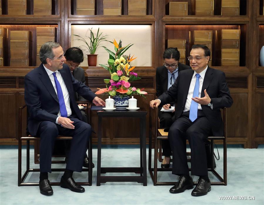 رئيس مجلس الدولة الصيني يجتمع مع رئيس وزراء اليونان السابق