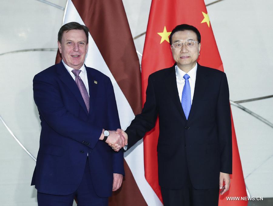 الصين ولاتفيا تتعهدان بدفع التعاون بينهما قدما