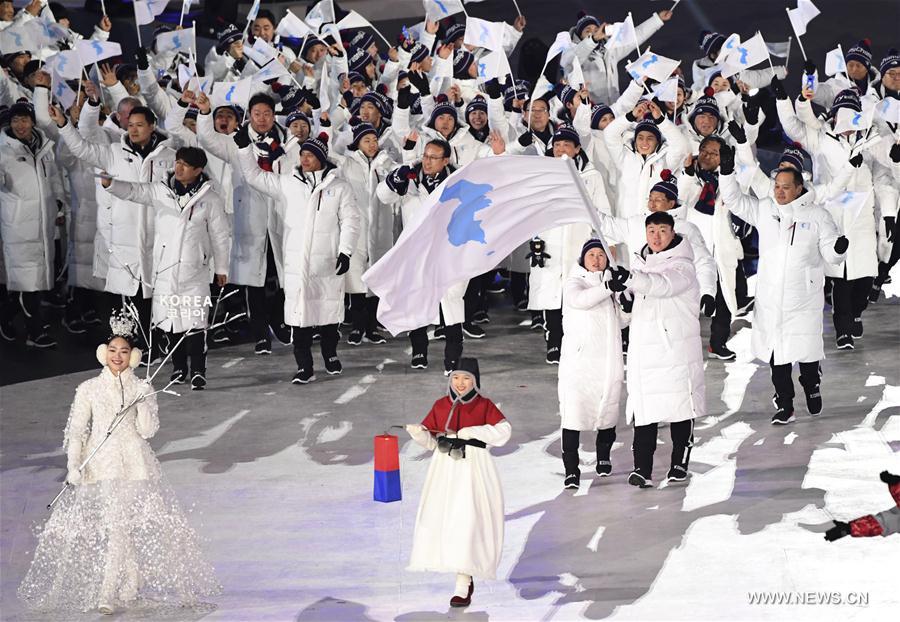 رياضيو كوريا الجنوبية وكوريا الديمقراطية يسيرون سويا فى افتتاح الأولمبياد الشتوية 