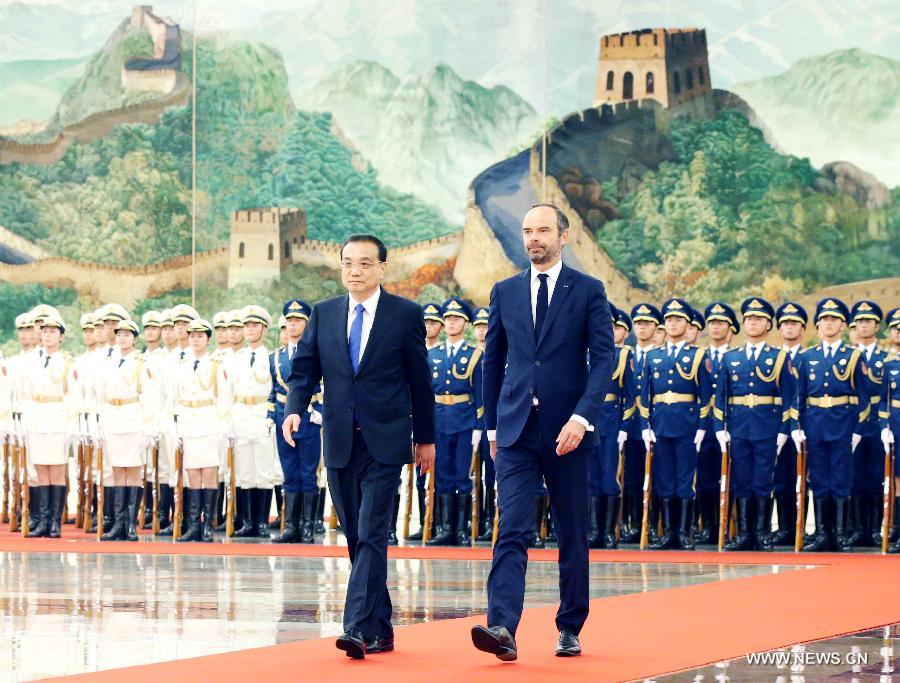 الصين وفرنسا تتعهدان بتعزيز التعاون البراجماتي
