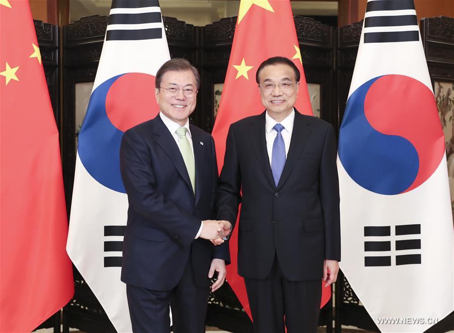 رئيس مجلس الدولة الصيني ورئيس جمهورية كوريا يبحثان سبل تعزيز التعاون
