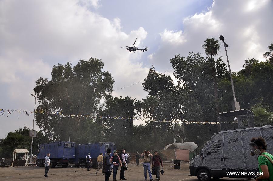 التليفزيون المصري: قوات الأمن تسيطر بالكامل على ميدان رابعة العدوية (4)