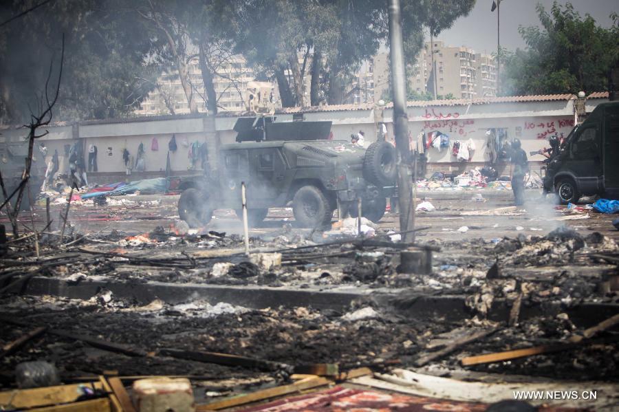 التليفزيون المصري: قوات الأمن تسيطر بالكامل على ميدان رابعة العدوية (14)